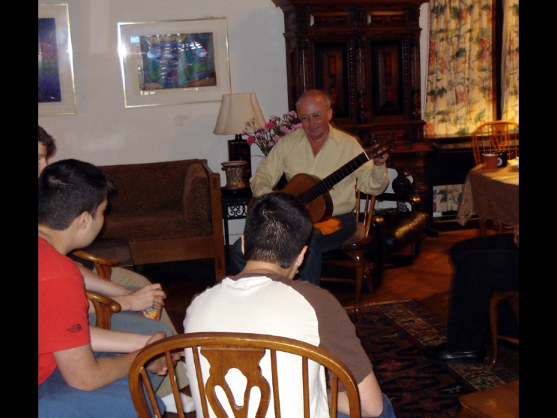 Millwood, NY - May 20, 2007: The 14 year-old twin sons of ZOHO President Jochen Becker, Lucas (left) and Carl (center) listening spellbound to Carlos Barbosa-Lima's private concert performance at the Becker's.