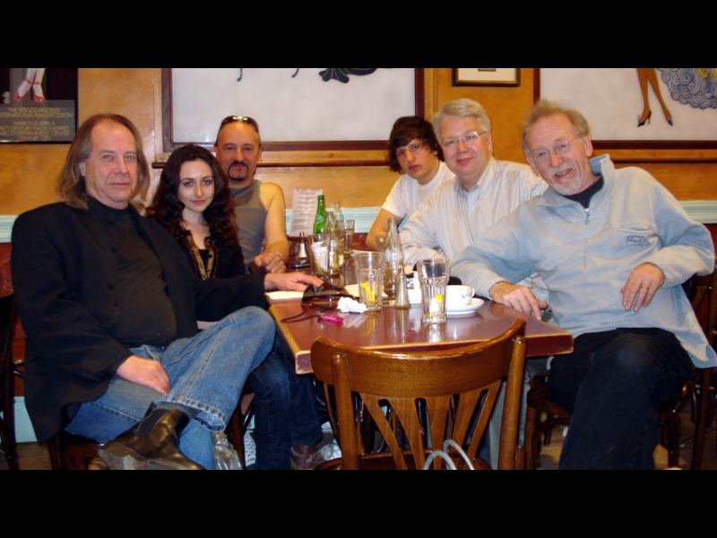 London, April 2007: Members of The Pretty Things grabbing a bite at Amato's, off Tottenham Court Road with the Cote Basque Productions team. From left:  Phil May, lead singer of The Pretty Things, Scarlett Wrench, lead singer of The Malchicks, Mark St John, principal of Cote Basque Productions, George Perez, guitarist with the Malchicks, Jochen Becker from ZOHO, and Dick Taylor, lead guitarist of The Pretty Things.
