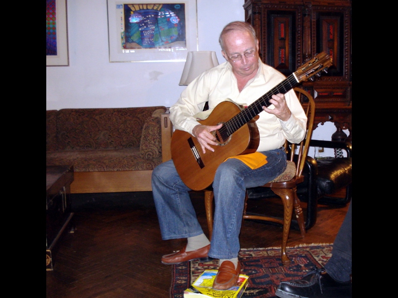Millwood, NY - May 20, 2007: ZOHO artist - Brazilian acoustic guitarist Carlos Barbosa-Lima on one of his rare visits to the New York area - during a private concert performance at the home of ZOHO President Jochen Becker. Watch the foot on phonebook.